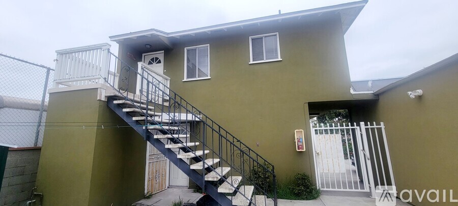A house with a staircase leading to the second floor.