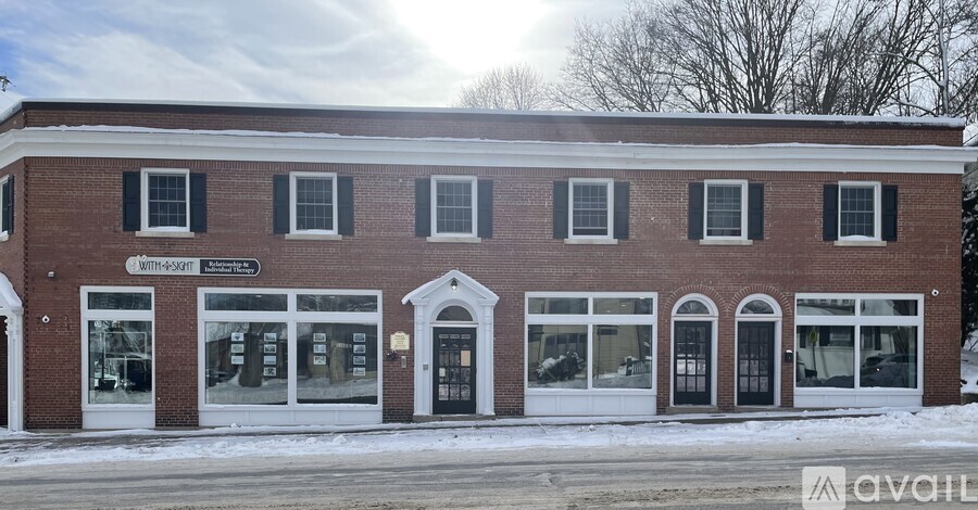 A brick building with a sign that says "Winthrop" on it.
