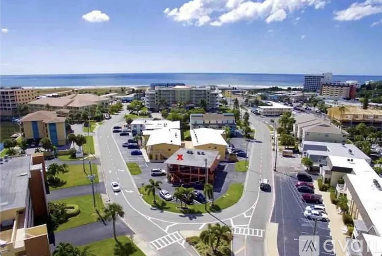 A view of a roundabout with a red cross in the middle.