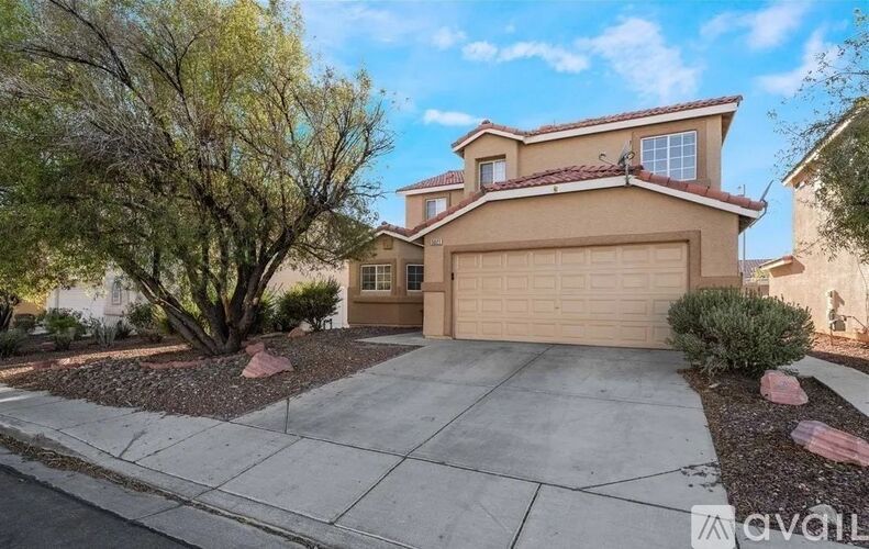 A house with a garage is for sale.