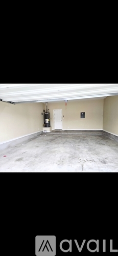 A bedroom with a bed, nightstand, and a ceiling fan.