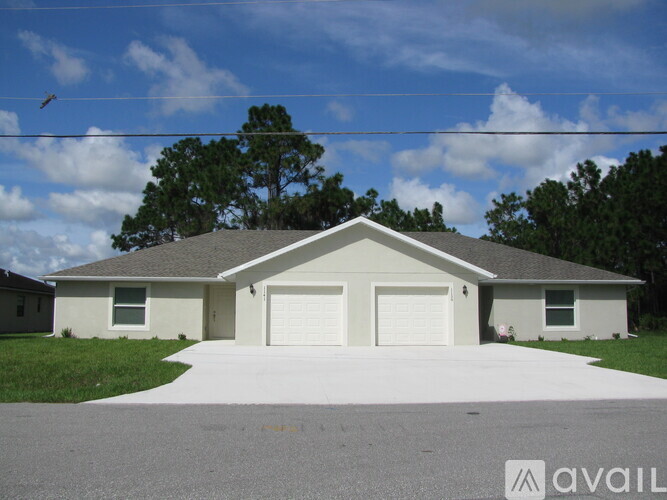 A house with a white garage door is for sale.
