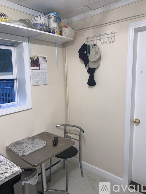 A small room with a table and a chair.
