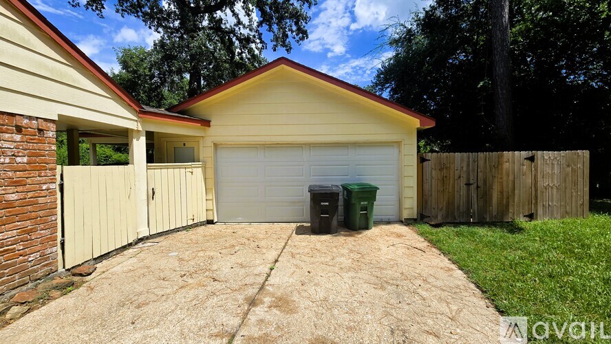 A house with a garage and a driveway.
