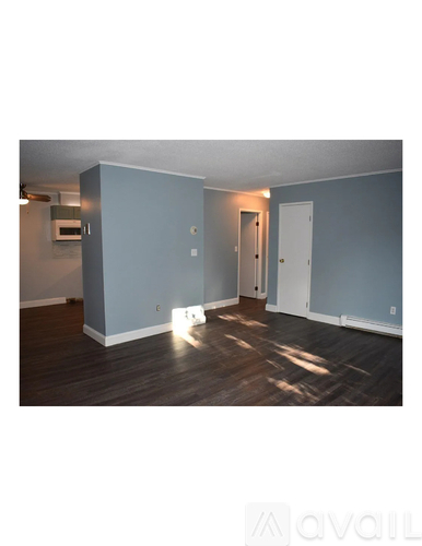 A room with a door and a window.