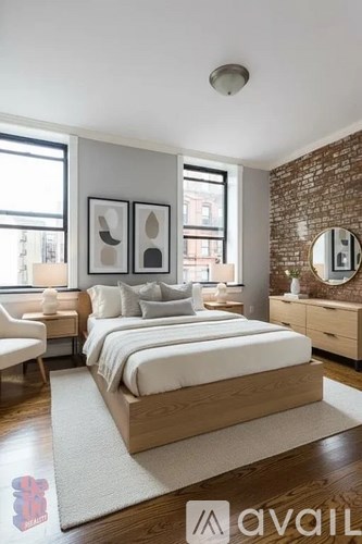 A bedroom with a large bed, a chair, and a dresser with a mirror.
