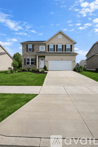 A house with a driveway in front of it.