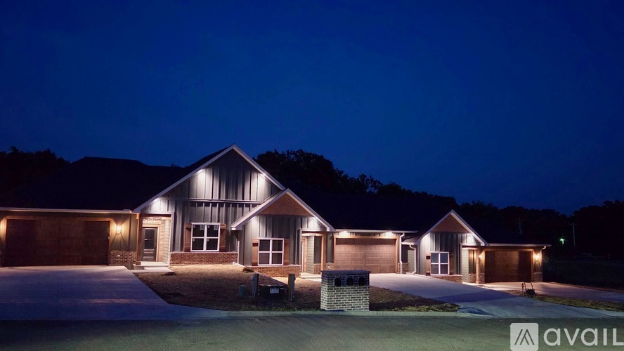 A house with a lit up sign that says "available" in front of it.