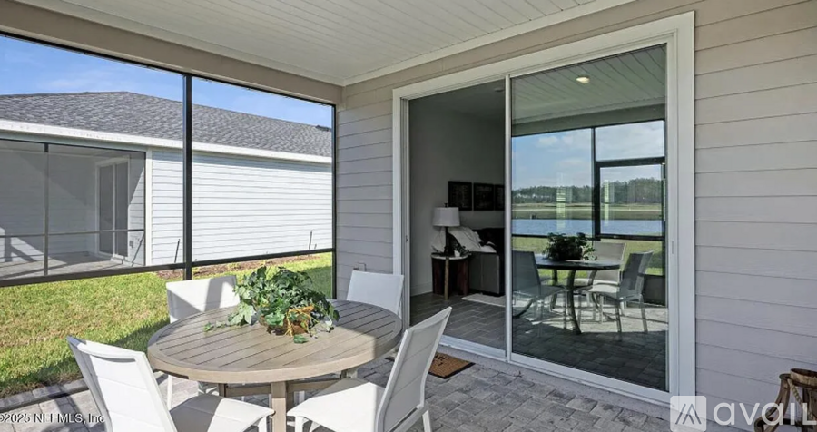 A patio with a table and chairs is shown.