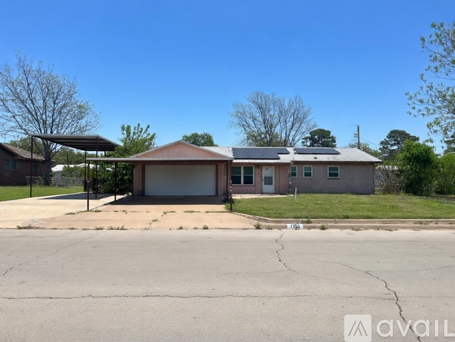 A house with a garage is available for sale.
