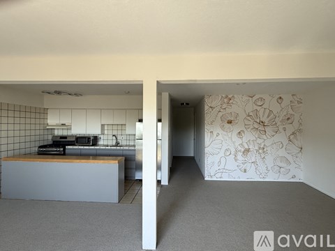 A kitchen with a counter and a microwave.