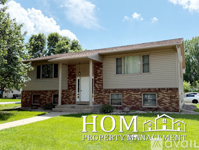 A house with the text HOMA Property Management in front of it.