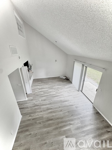 A room with a grey floor and white walls.