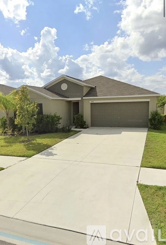 A house with a driveway in front of it.