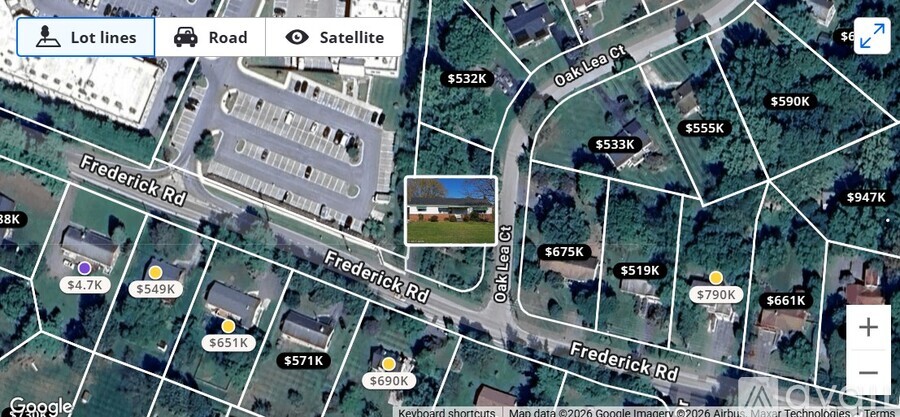 A satellite image of a street with Frederick Rd and a building in the background.