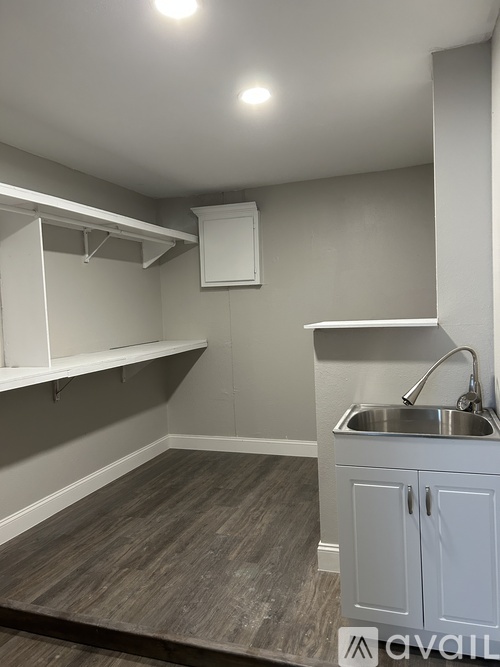 A kitchen with a sink and cabinets.