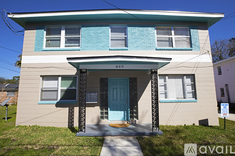 A house with the number 849 on the front porch.