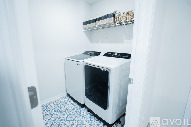Two white ovens in a small kitchen.