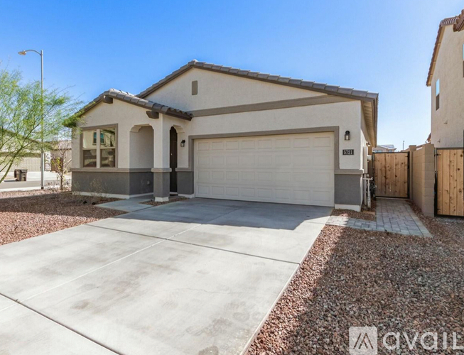 A house with a garage is for sale.