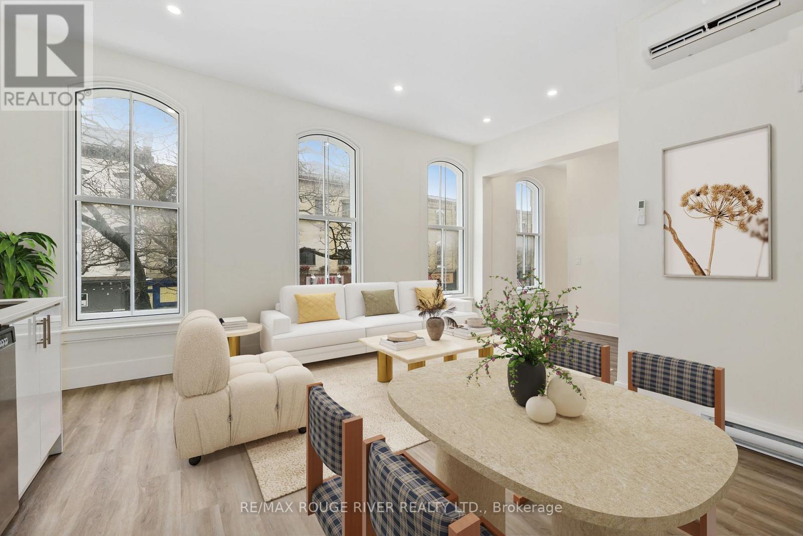 A well-lit, modern dining room with a table set for four.