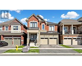 A row of houses with garages and a fire hydrant in front.
