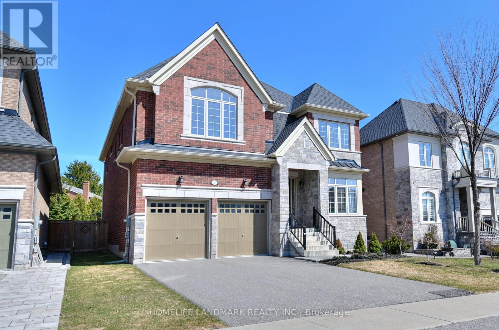 A large brick house with a garage is for sale.