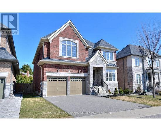 A large brick house with a garage is for sale.