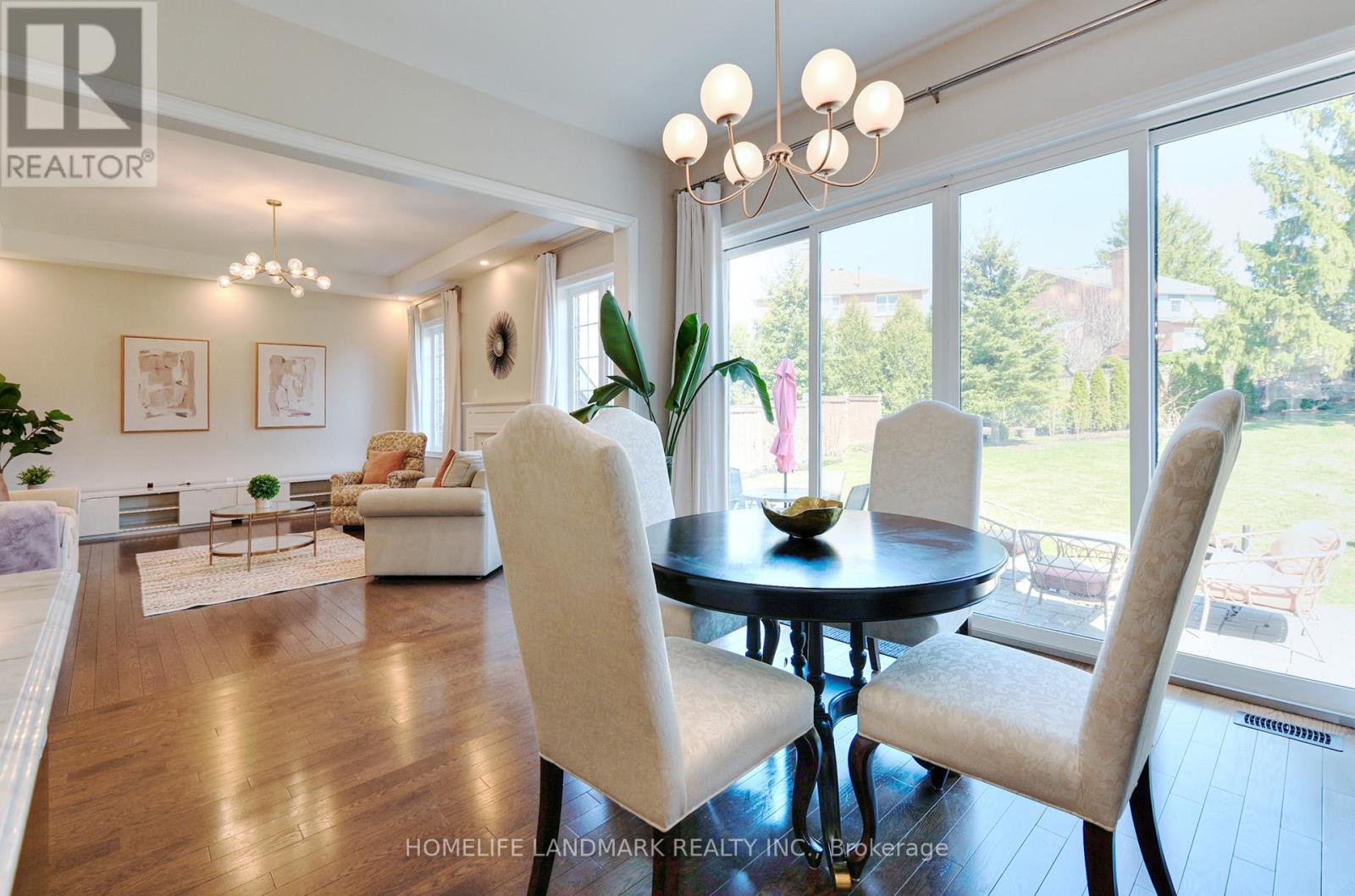 A well-lit dining room with a table set for two.