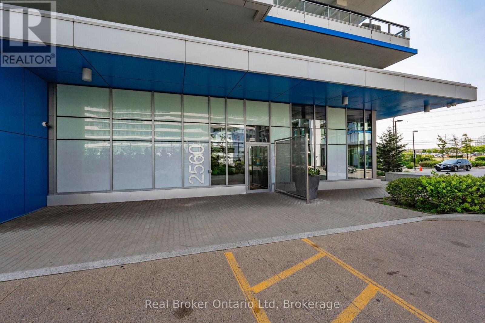The image shows the front of a building with the sign "REALTOR" on it.