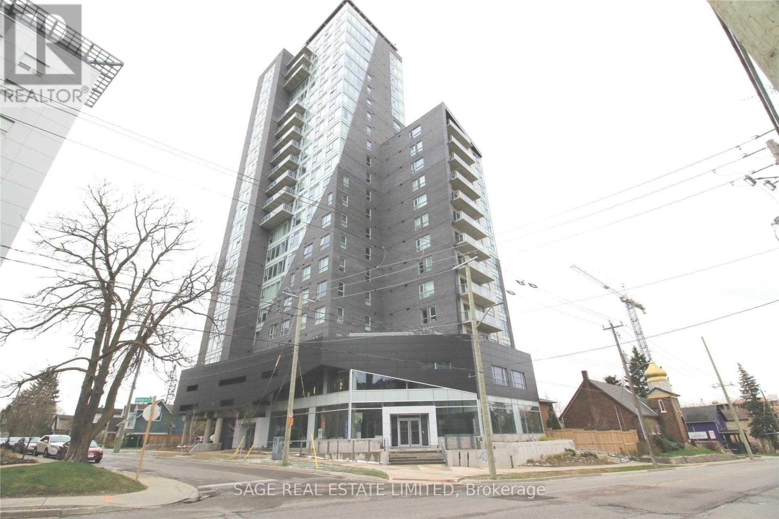 A tall building with a glass facade is under construction.
