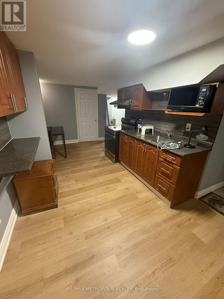A kitchen with wooden cabinets and a countertop.