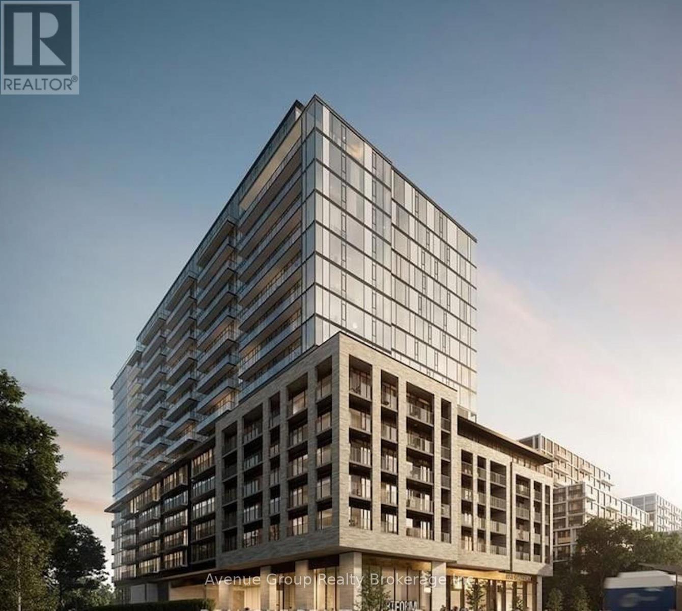 A modern building with a glass facade is depicted in the image.