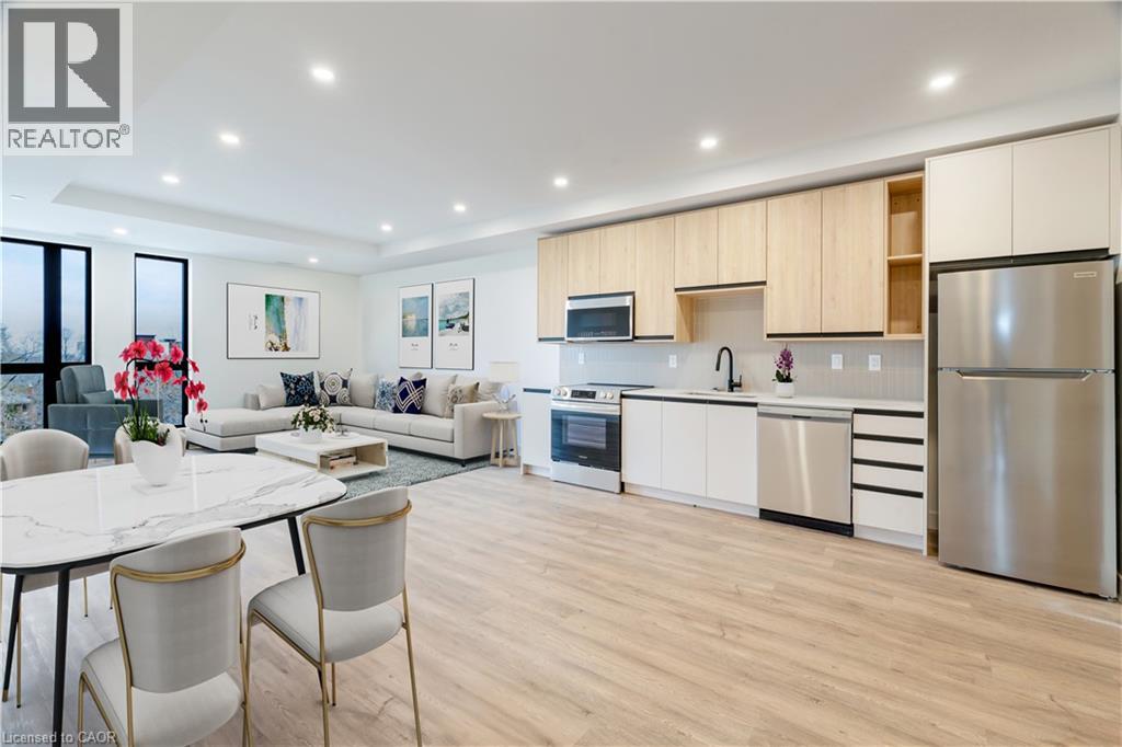 A modern kitchen and dining area with a white table and chairs.