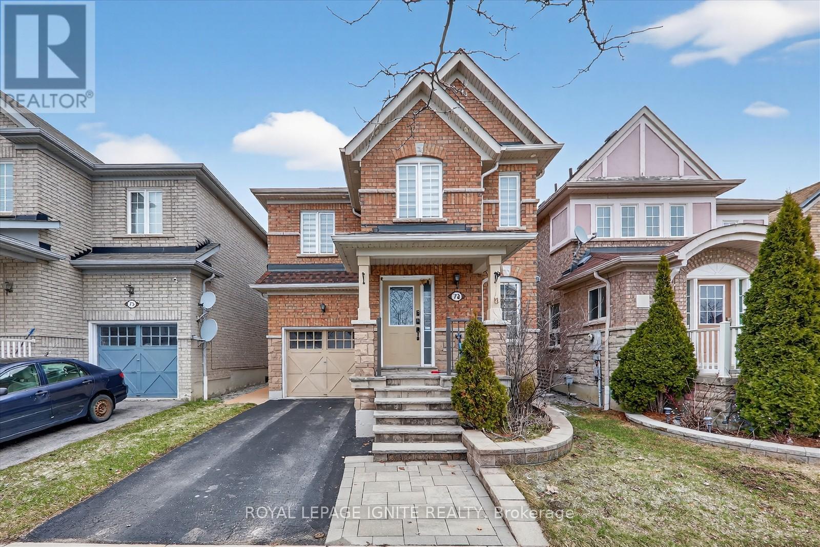 A large house with a driveway in front of it.