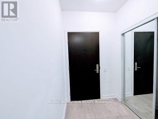 A room with a black door and a white door.