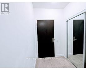 A room with a black door and a white door.