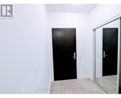 A room with a black door and a white door.