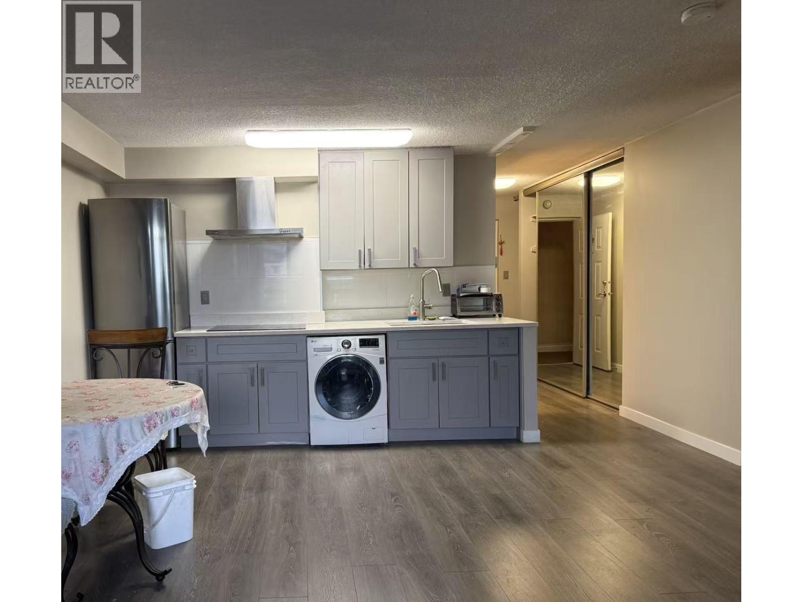 A realtor logo is on the top left corner of the image.