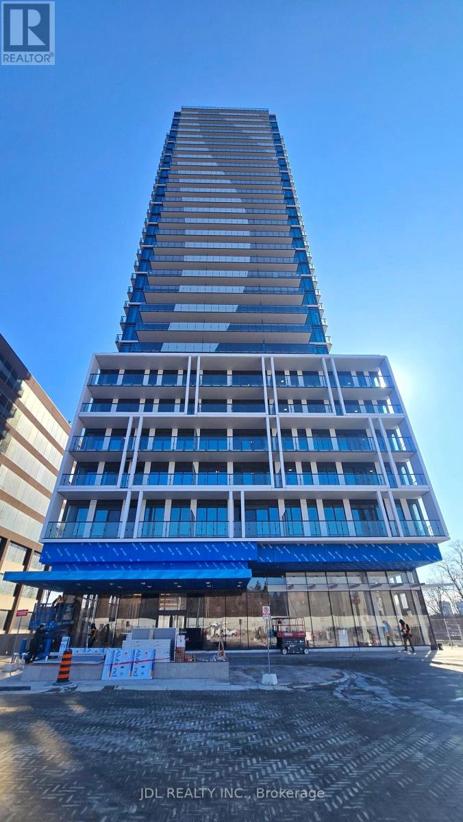 A tall building under construction with a blue sky in the background.