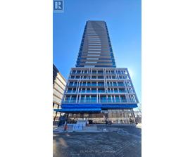 A tall building under construction with a blue sky in the background.