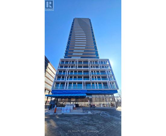 A tall building under construction with a blue sky in the background.