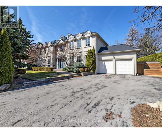 A large house with a driveway in front of it.