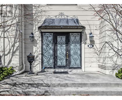 A house with a black door and a black lamp post.