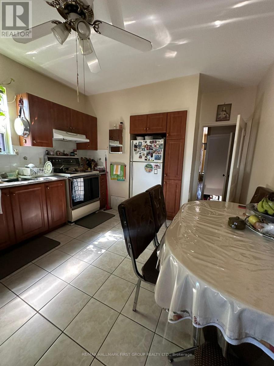 A kitchen with a table and chairs in it.