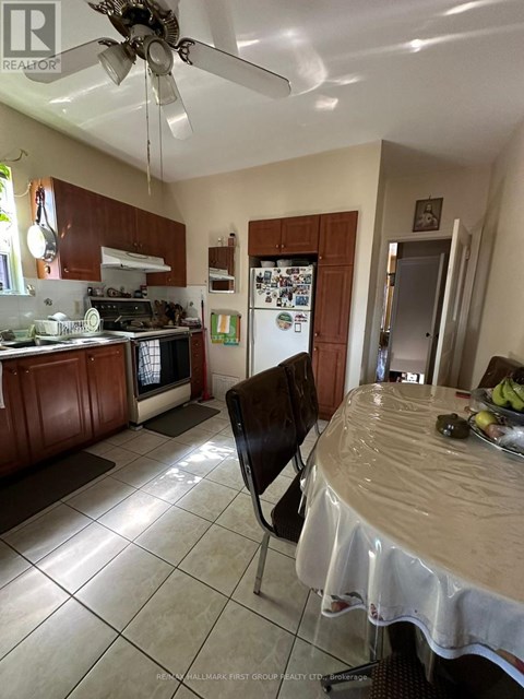 A kitchen with a table and chairs in it.