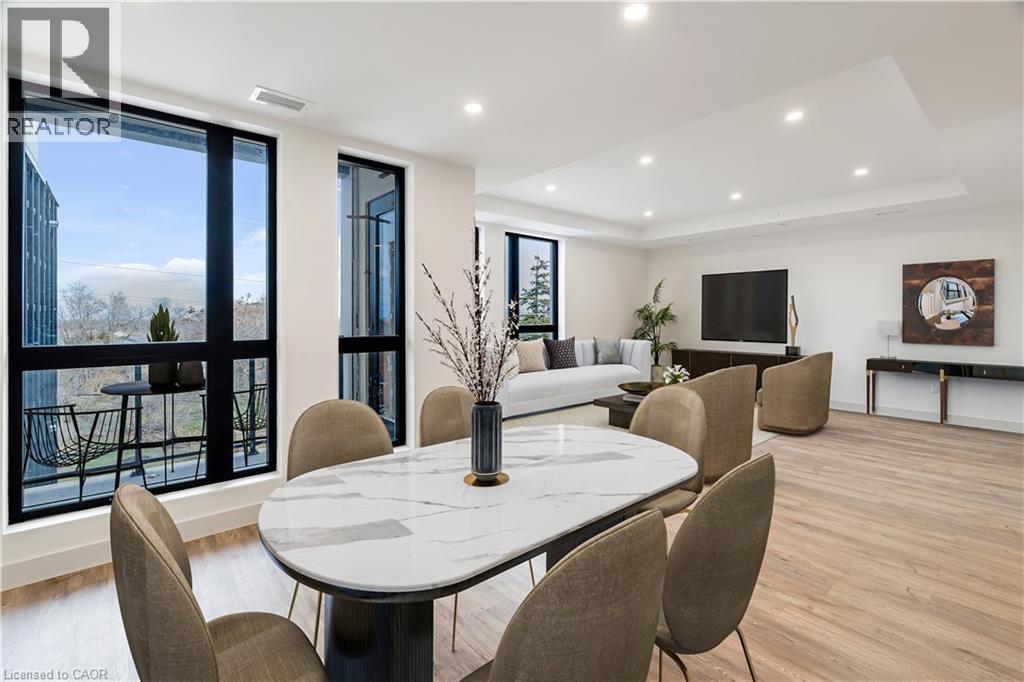 A modern dining room with a large table and chairs.