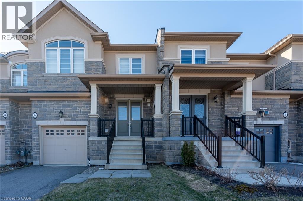 A large house with a garage and a driveway.
