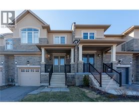 A large house with a garage and a driveway.
