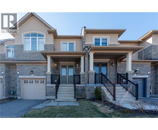 A large house with a garage and a driveway.