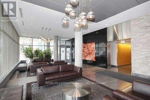 A modern living room with a large couch and a coffee table.